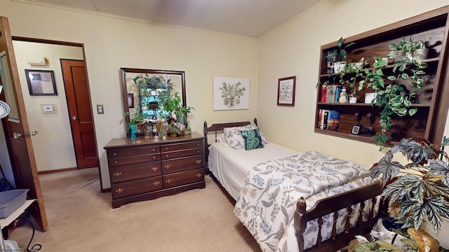 carpeted bedroom featuring ornamental molding