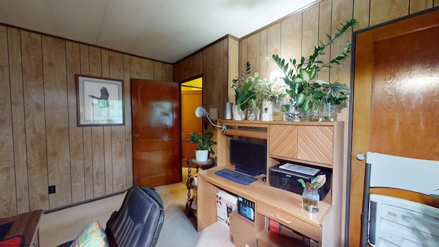 carpeted office with wood walls