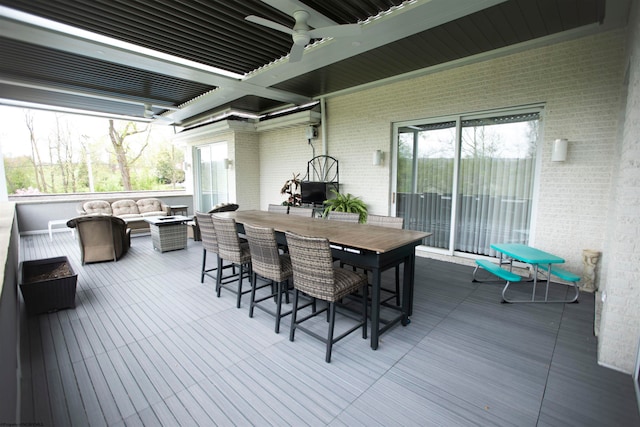 wooden deck featuring an outdoor hangout area