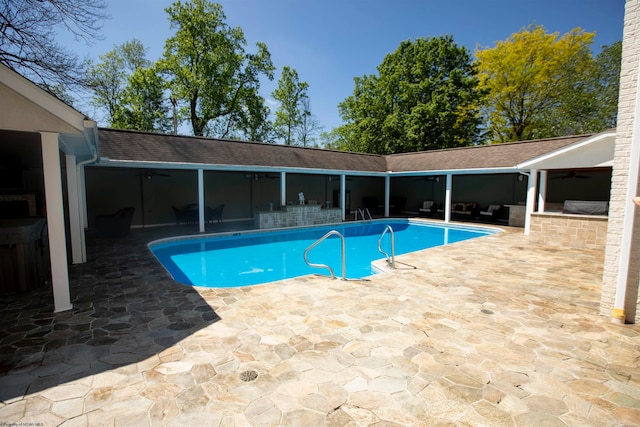 view of swimming pool featuring a patio area