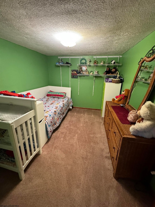 carpeted bedroom featuring a textured ceiling