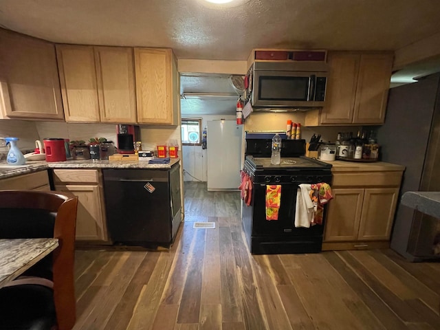 kitchen featuring dark wood-type flooring, light brown cabinetry, electric range, dishwasher, and a textured ceiling