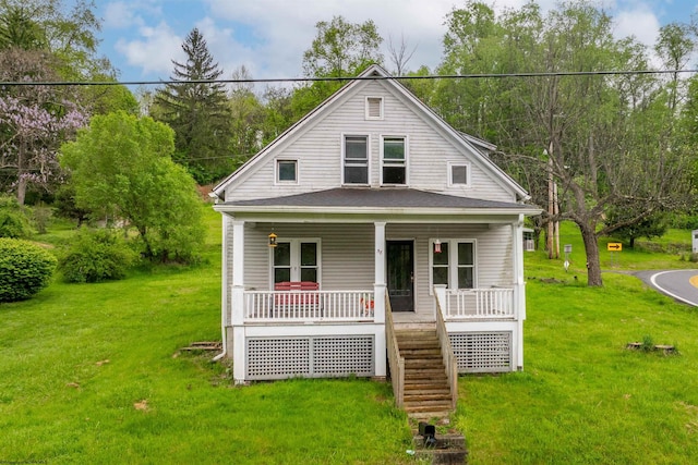 view of front of house with a front yard and a porch