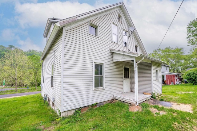 rear view of house with a lawn