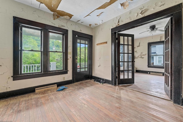 foyer with ceiling fan and hardwood / wood-style flooring