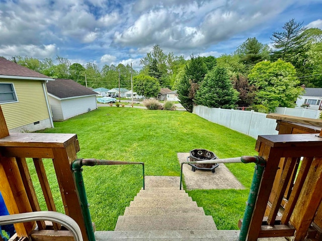 view of yard with a fire pit