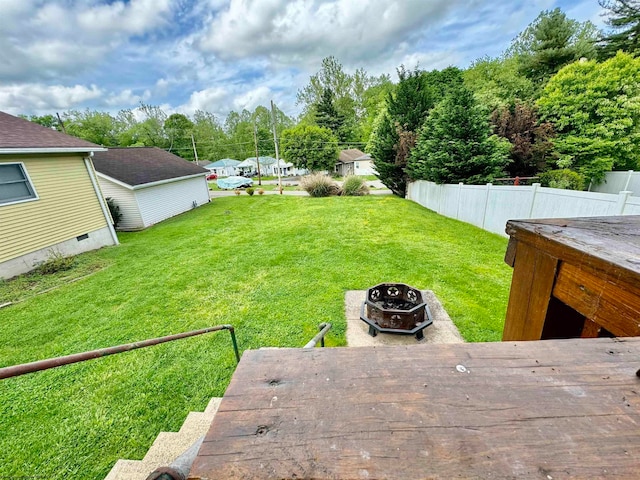 view of yard with a fire pit