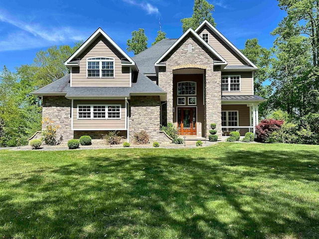 craftsman-style house with a front yard