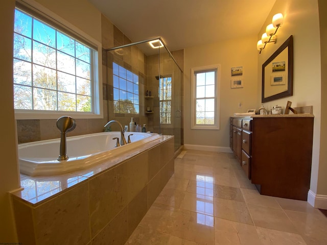 bathroom featuring a wealth of natural light, vanity, separate shower and tub, and tile flooring