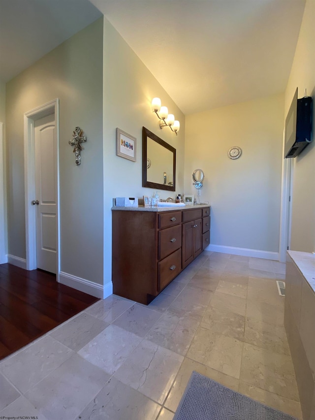 bathroom featuring vanity and hardwood / wood-style flooring