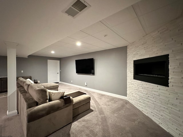 living room with carpet flooring and a fireplace