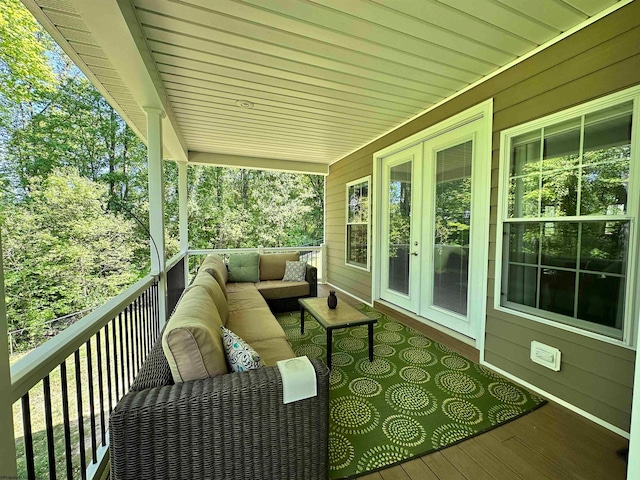 deck with an outdoor living space and french doors