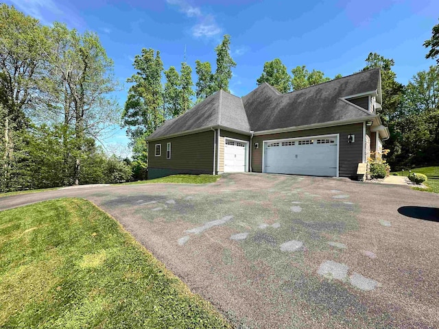 view of side of home with a garage