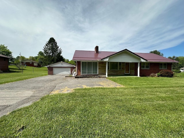 ranch-style house featuring a porch, a garage, an outdoor structure, and a front yard