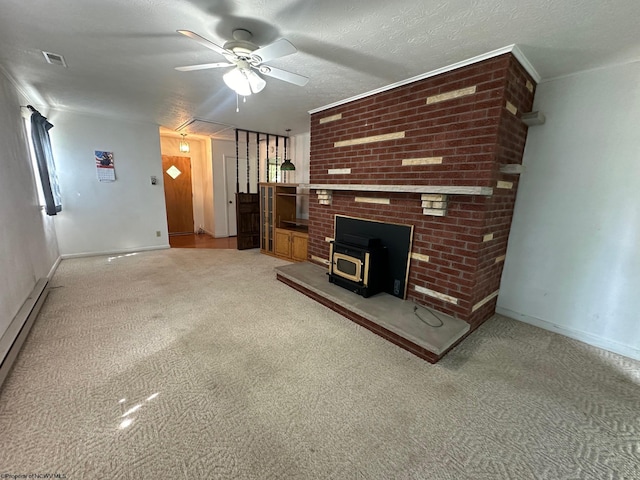 unfurnished living room featuring a baseboard radiator, carpet flooring, a wood stove, ceiling fan, and a textured ceiling