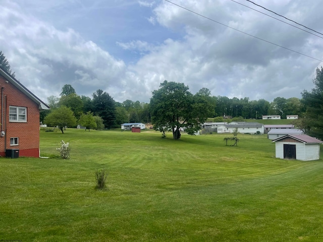 view of yard with central AC unit