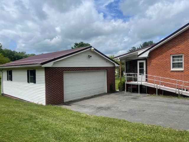 view of property exterior with a yard, a garage, and an outdoor structure