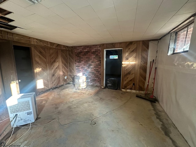 interior space with wooden walls and concrete flooring