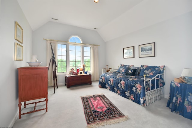 carpeted bedroom featuring vaulted ceiling