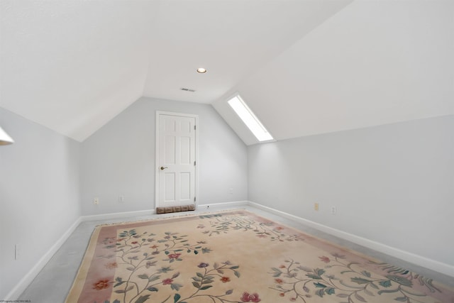 bonus room with lofted ceiling with skylight