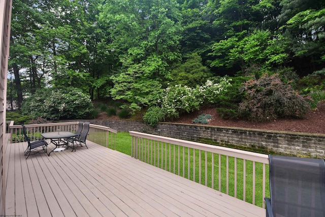 wooden deck with a lawn