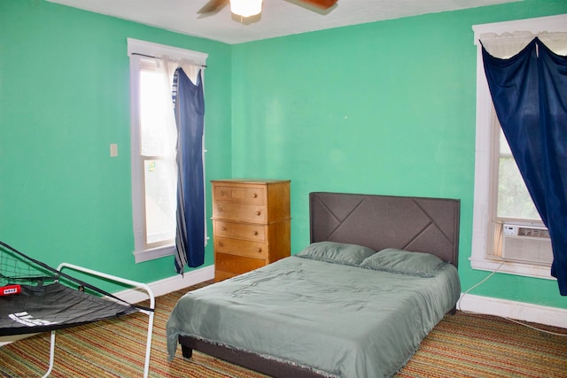 bedroom featuring ceiling fan and cooling unit