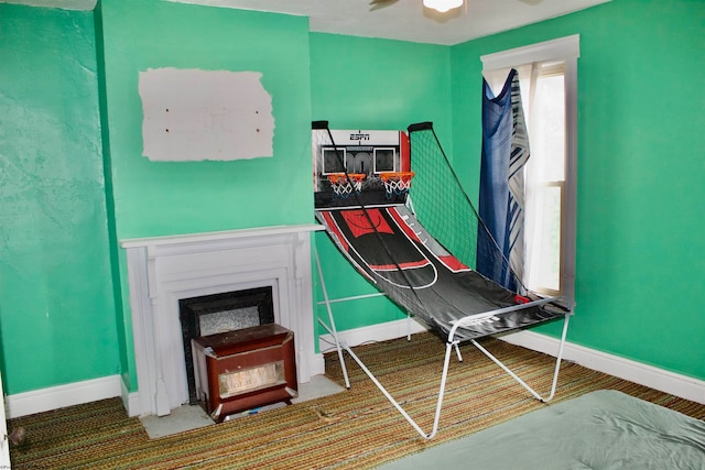 interior space with ceiling fan