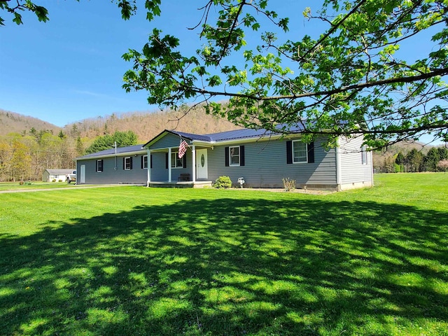 view of front of home with a front lawn