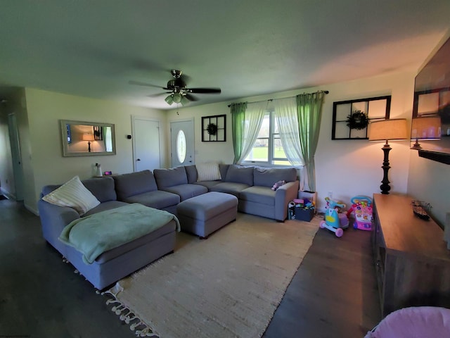 living room with hardwood / wood-style floors and ceiling fan