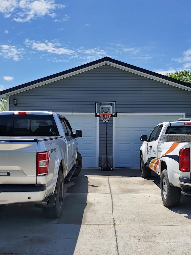 view of parking / parking lot with a garage