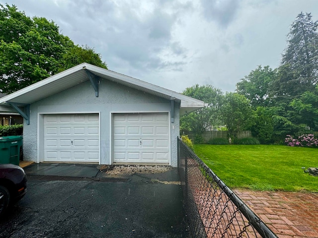 garage with a yard