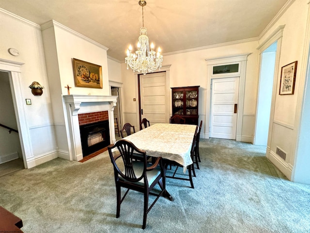 dining area featuring a notable chandelier, carpet flooring, and ornamental molding