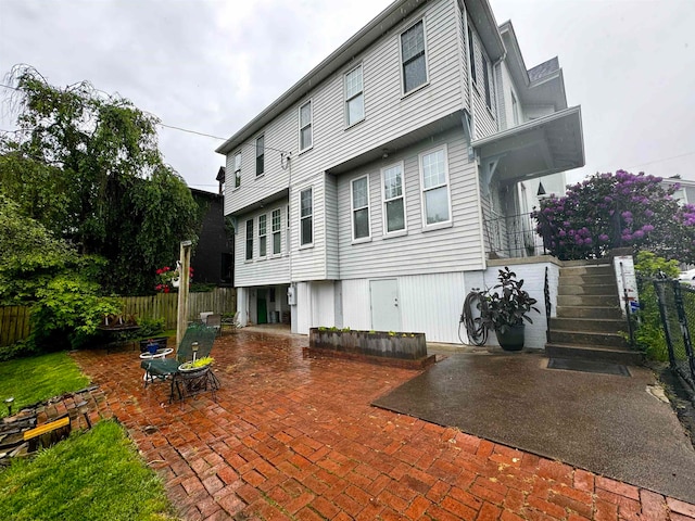 back of property featuring a patio area