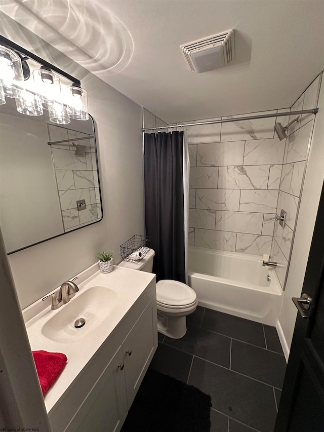 full bathroom featuring tile flooring, vanity with extensive cabinet space, toilet, and shower / tub combo