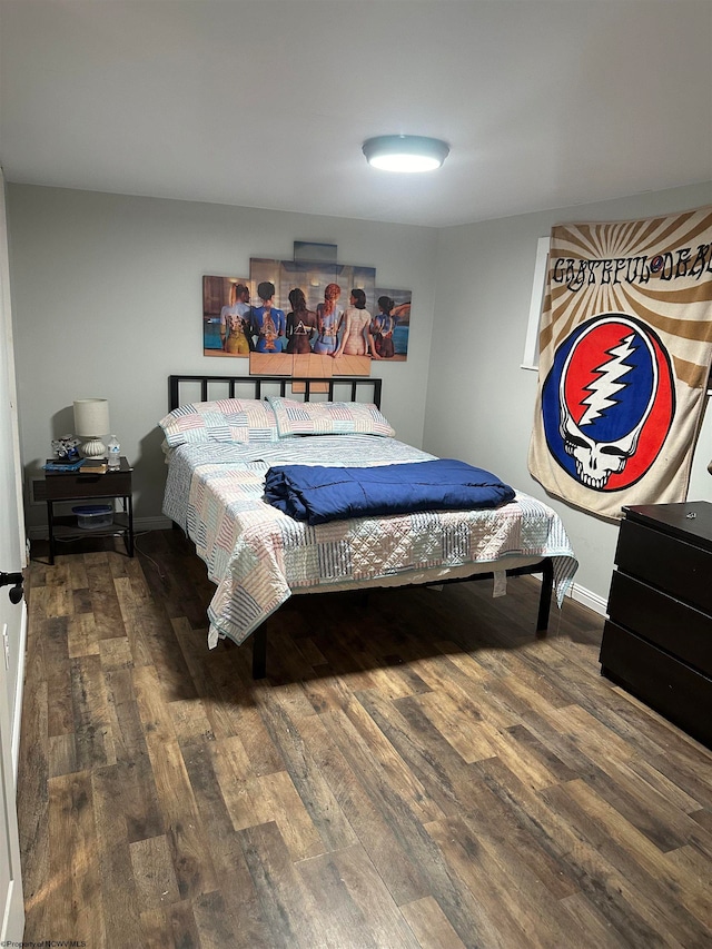 bedroom featuring wood-type flooring