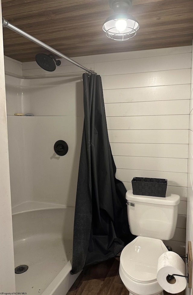 bathroom with wood-type flooring, walk in shower, wood ceiling, and toilet