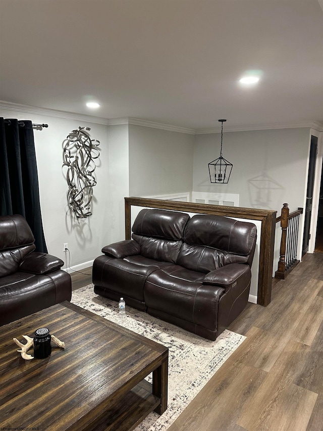 living room with ornamental molding and wood-type flooring