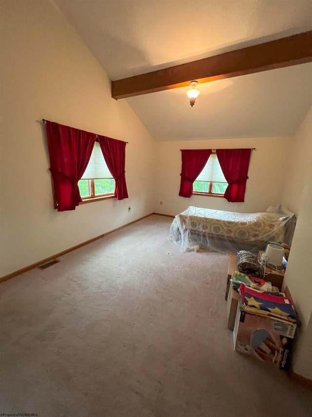 bedroom featuring carpet and lofted ceiling with beams