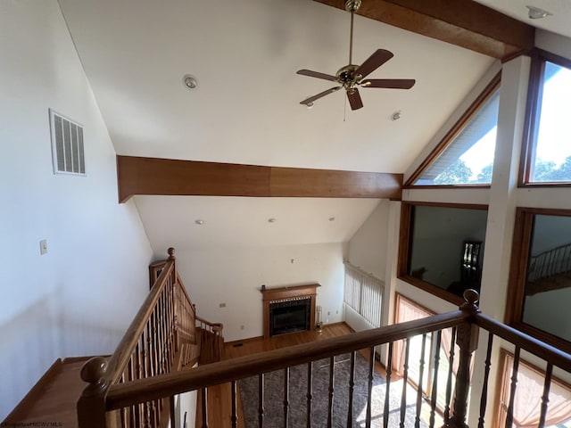 hallway featuring high vaulted ceiling