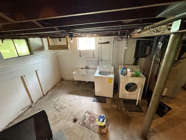 basement featuring sink and independent washer and dryer