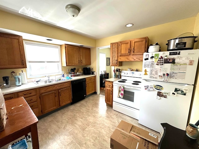 kitchen featuring sink and white appliances