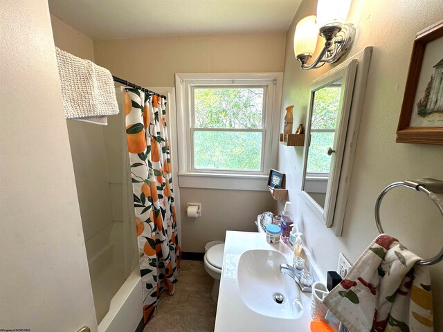 full bathroom featuring tile flooring, sink, shower / bath combination with curtain, and toilet