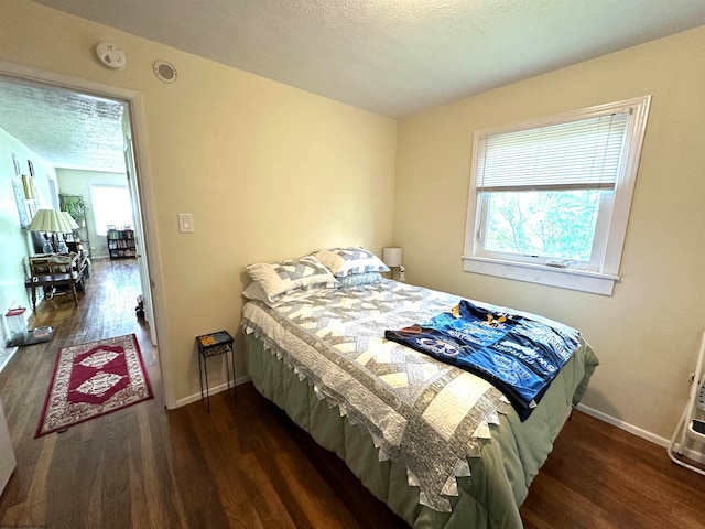 bedroom featuring dark hardwood / wood-style floors