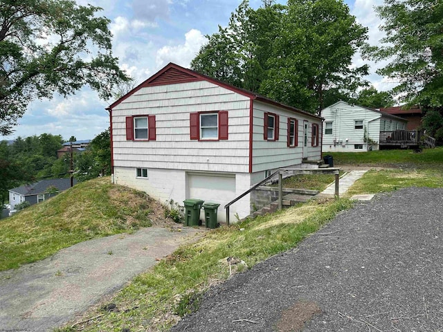 view of side of home with a garage