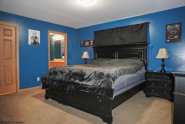 carpeted bedroom featuring ensuite bathroom