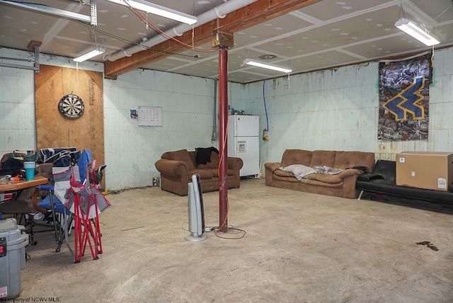 basement with white fridge