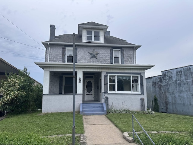 front facade featuring a front yard