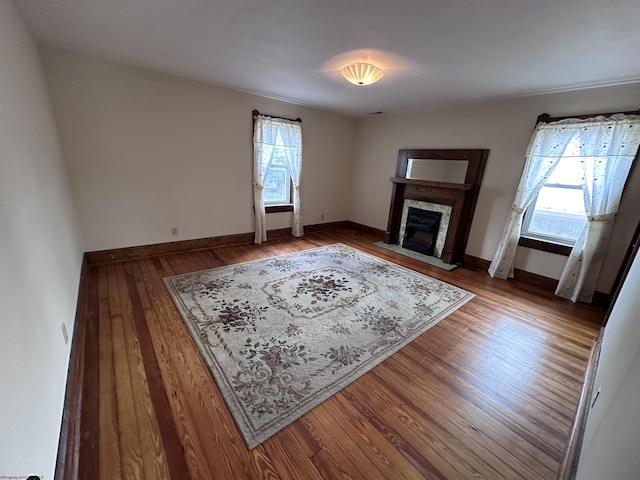 unfurnished living room with hardwood / wood-style flooring