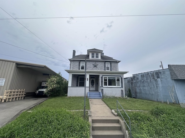 view of front of house featuring a porch and a front yard