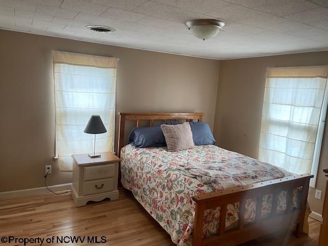 bedroom featuring light hardwood / wood-style floors